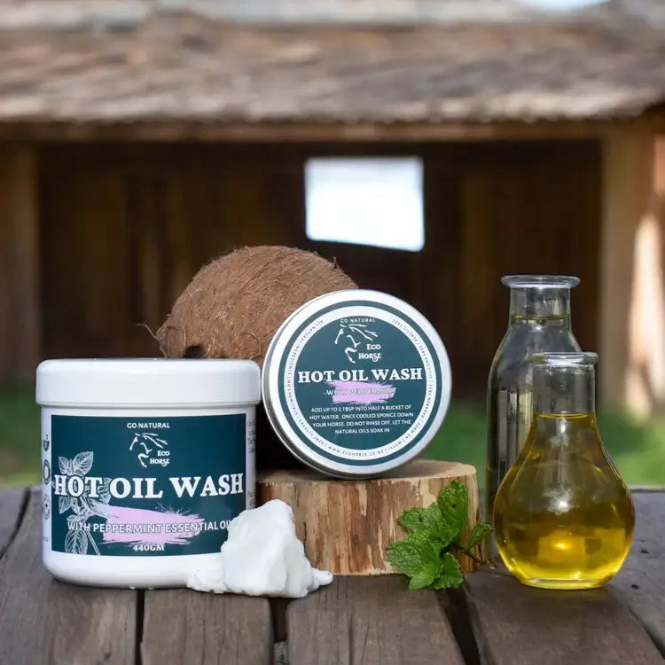 Eco Horse Hot Oil Wash products with natural oils in rustic setting, perfect for soothing skin and enhancing coat shine.