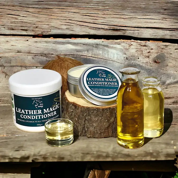 Eco Horse Leather Magic Conditioner jars and oil bottles on a wooden background, highlighting natural leather care.