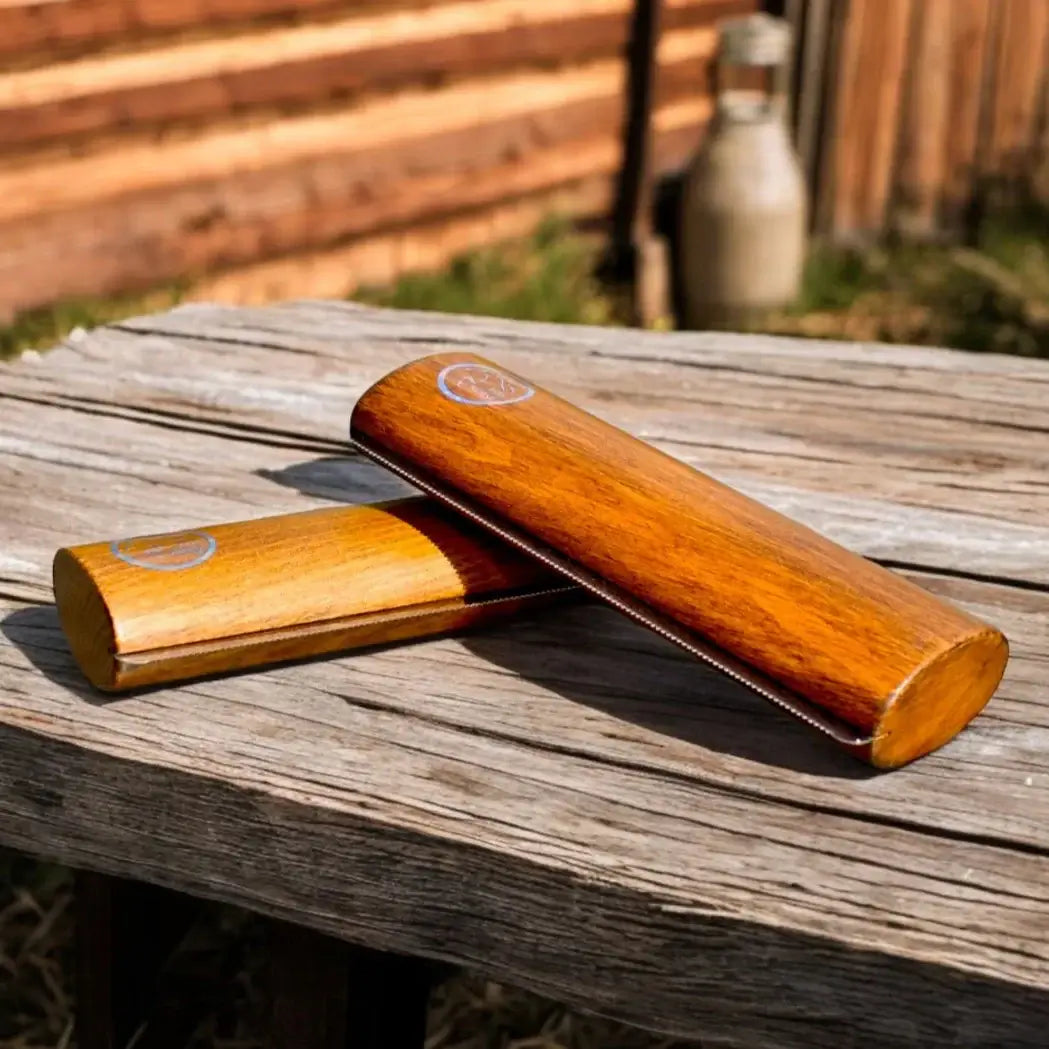 Eco Horse Eco Shedder with Beach Wood handles on a rustic wooden table, ideal for horse grooming and removing dirt.