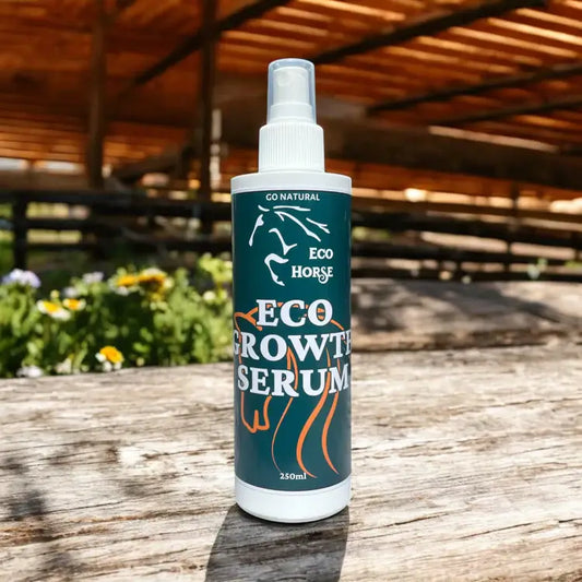 Eco Horse Growth Serum bottle on a wooden table, promoting mane and tail growth with essential oils.