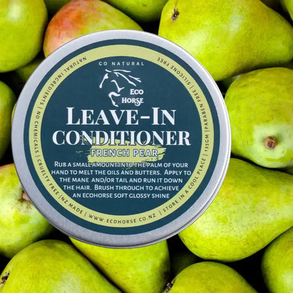 Eco Horse Leave-In Conditioner with French Pear scent against a backdrop of fresh pears.
